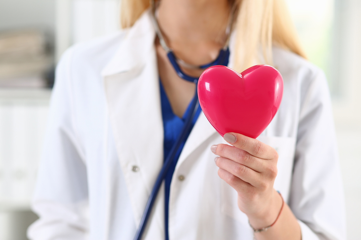Female Medicine Doctor Hands Holding Red Heart
